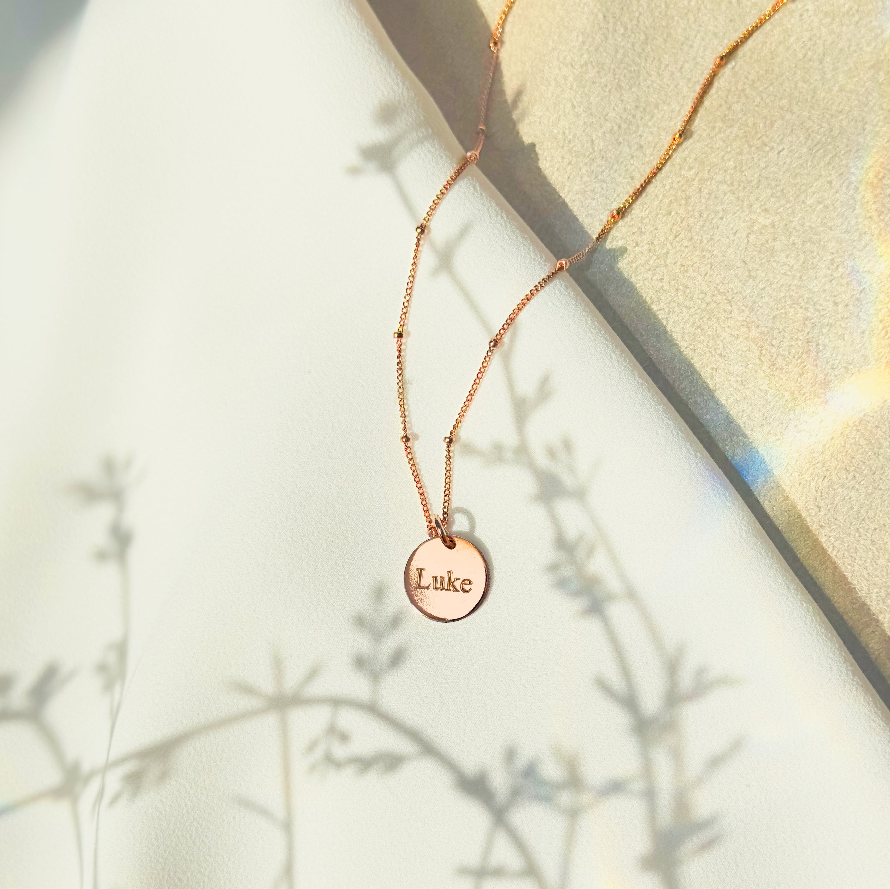 Rose gold satellite chain with engraved disc name luke. Personalized initial disc gold, rose gold , or sterling silver necklace, custom necklace for graduation, letter pendant necklace, family tree jewelry, dainty initial necklace, gift for mom, custom name necklace, engraved graduation gift, layered charm necklace, unique initial pendant, gold filled necklaces with initials, letter necklaces, initial jewelry for women, dainty trendy initial necklace round disc, pendant necklace engravable