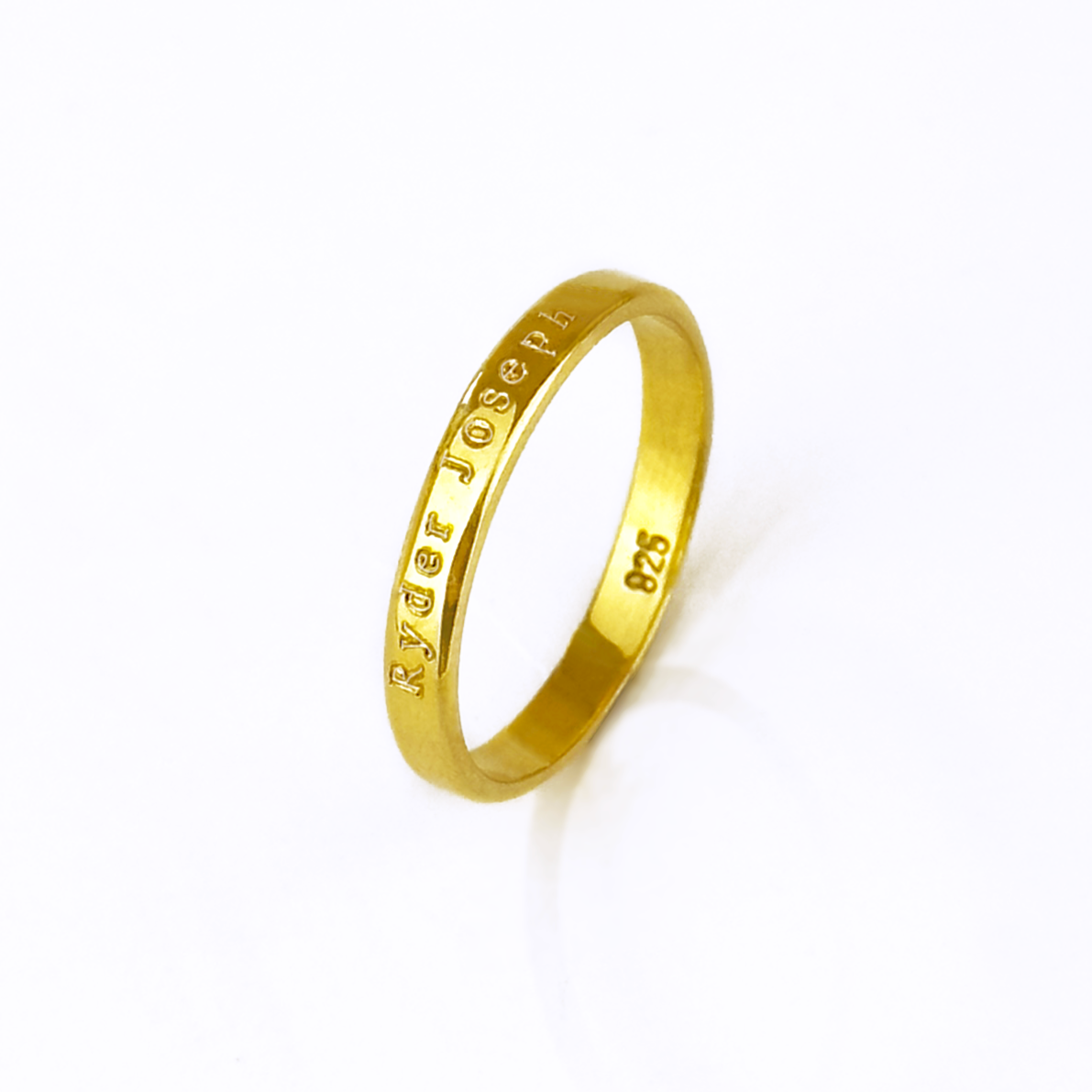 Custom 3mm gold engraved ring with text personalization shown on white background. Slim and minimalist unisex band designed for engraving names, dates, or meaningful phrases. Perfect as a wedding band, promise ring, or everyday stacking ring, this dainty engraved band is available in sterling silver, gold, or rose gold. A meaningful keepsake gift crafted with precision engraving and timeless design for couples or individuals.