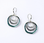 beautiful three-ring circles statement earrings with silver and blue tones on white background