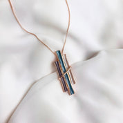 Rose gold boho style geometric branch pendant necklace on white background. statement jewelry, statement boho necklace, purple, blue, gray, rose. bohemian jewelry,