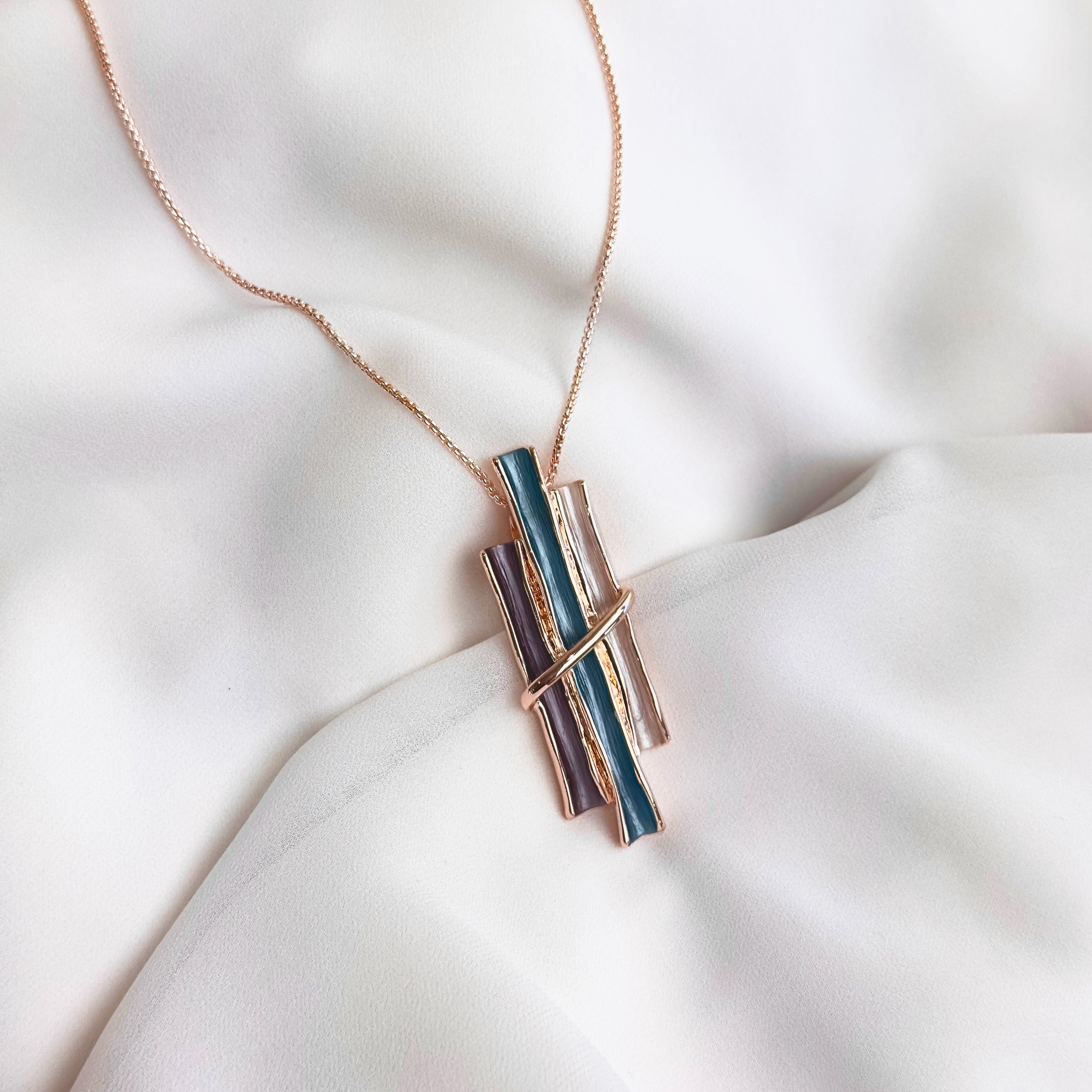 Rose gold boho style geometric branch pendant necklace on white background. statement jewelry, statement boho necklace, purple, blue, gray, rose. bohemian jewelry,