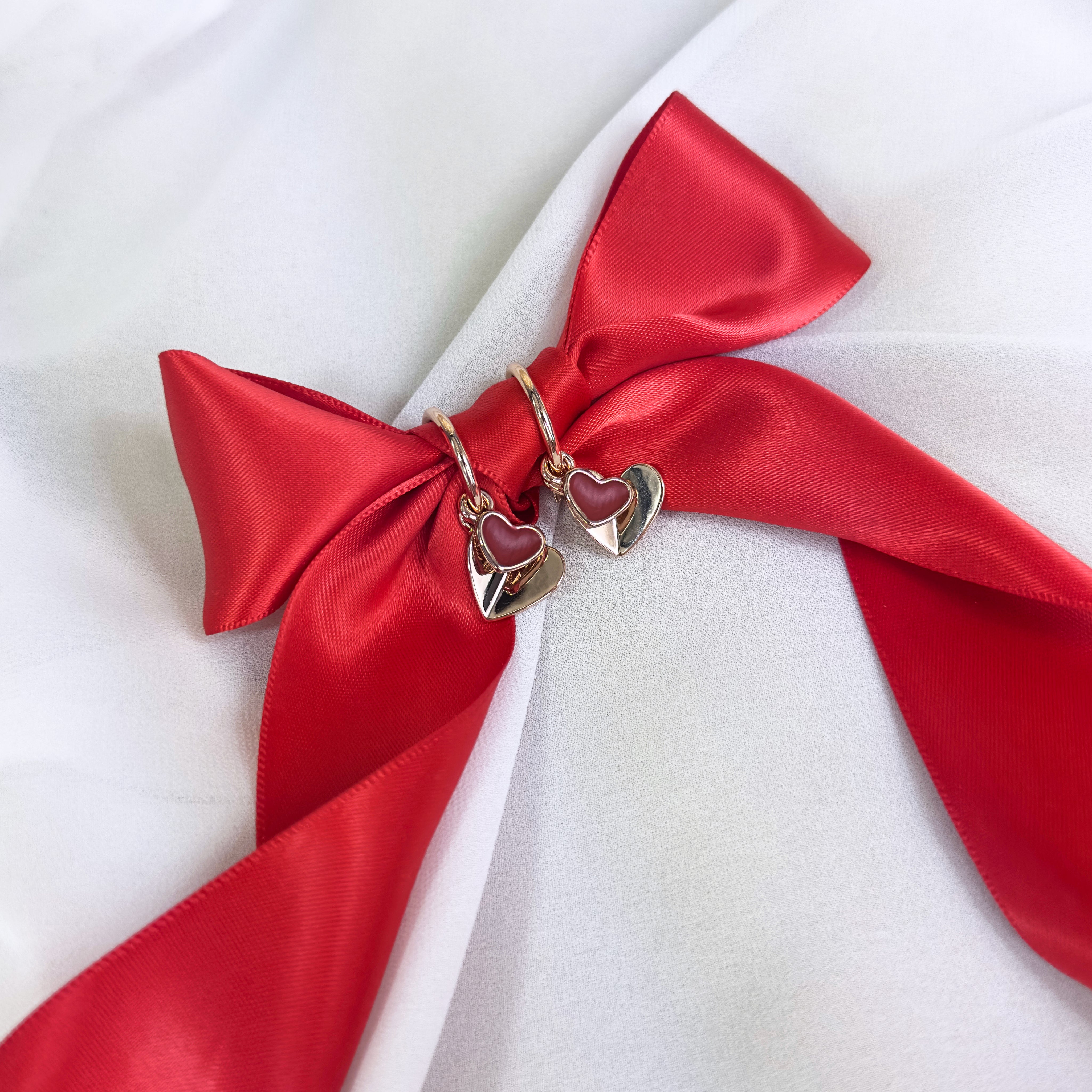 Rose gold double hearts pendant  hoop dangle earrings set on white background with a bow. Heart charms, heart necklace, statement necklace, bohemian jewelry, boho jewelry