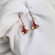 Rose gold double hearts pendant hoop dangle earrings set on white background. Heart charms, heart necklace, statement necklace, bohemian jewelry, boho jewelry