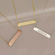 Three elegant engraved bar necklaces in rose gold, yellow gold, and sterling silver tones displayed side by side, featuring delicate soundwave designs symbolizing a baby’s first heartbeat. These heartbeat jewelry pieces are meaningful keepsakes for mothers and families, making a thoughtful pregnancy gift, remembrance jewelry, or personalized push present handcrafted with love and precision.