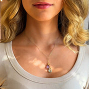 Model wearing gold lariat necklace with purple and green amethyst gemstones and heart charms. jewelry gift, necklace gift for her, anniversary gift, christmas gift, valentine's day gift, wedding jewelry, bridesmaid's jewelry, gift for mom, gift for wife, gift for girlfriend, gift for grandma, mother's day gift, february birthstone jewelry, february gemstone, february birthstone necklace