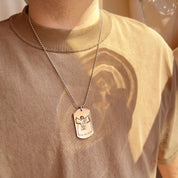 Man wearing a personalized photo engraved dog tag necklace with custom image and “I Love You Daddy” message on a stainless steel pendant. The necklace hangs on a silver ball chain, shown styled with a casual beige shirt. A meaningful keepsake jewelry gift for dads from kids, perfect for Father’s Day, birthdays, Christmas, or everyday wear. Unique custom photo necklace that captures family love and turns special memories into a lasting piece he can keep close to his heart.
