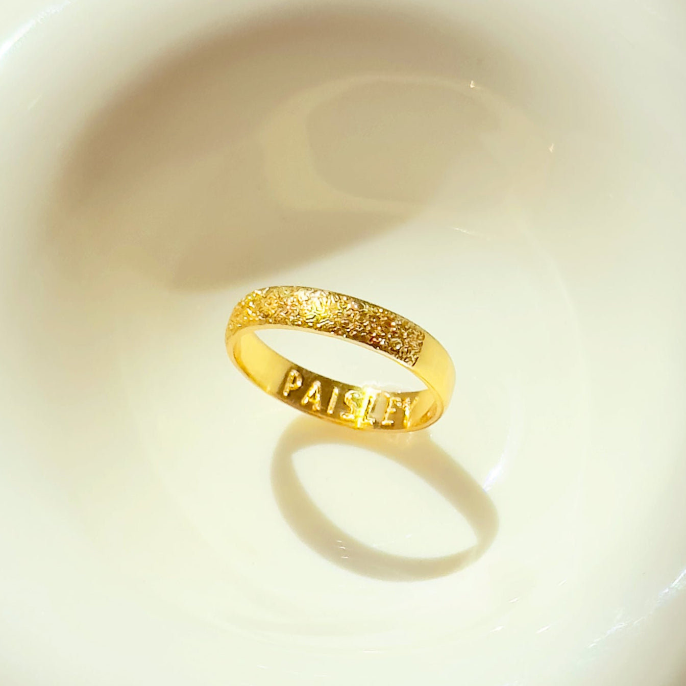 Minimalist pet memorial ring photographed on a neutral background, showing the smooth bezel-free 4mm profile and crisp dog nose print texture. Custom-made in sterling silver, gold vermeil, or rose gold vermeil, with optional interior inscription. Thoughtful personalized pet memorial gift and stylish everyday keepsake for dog lovers and grieving pet parents alike.