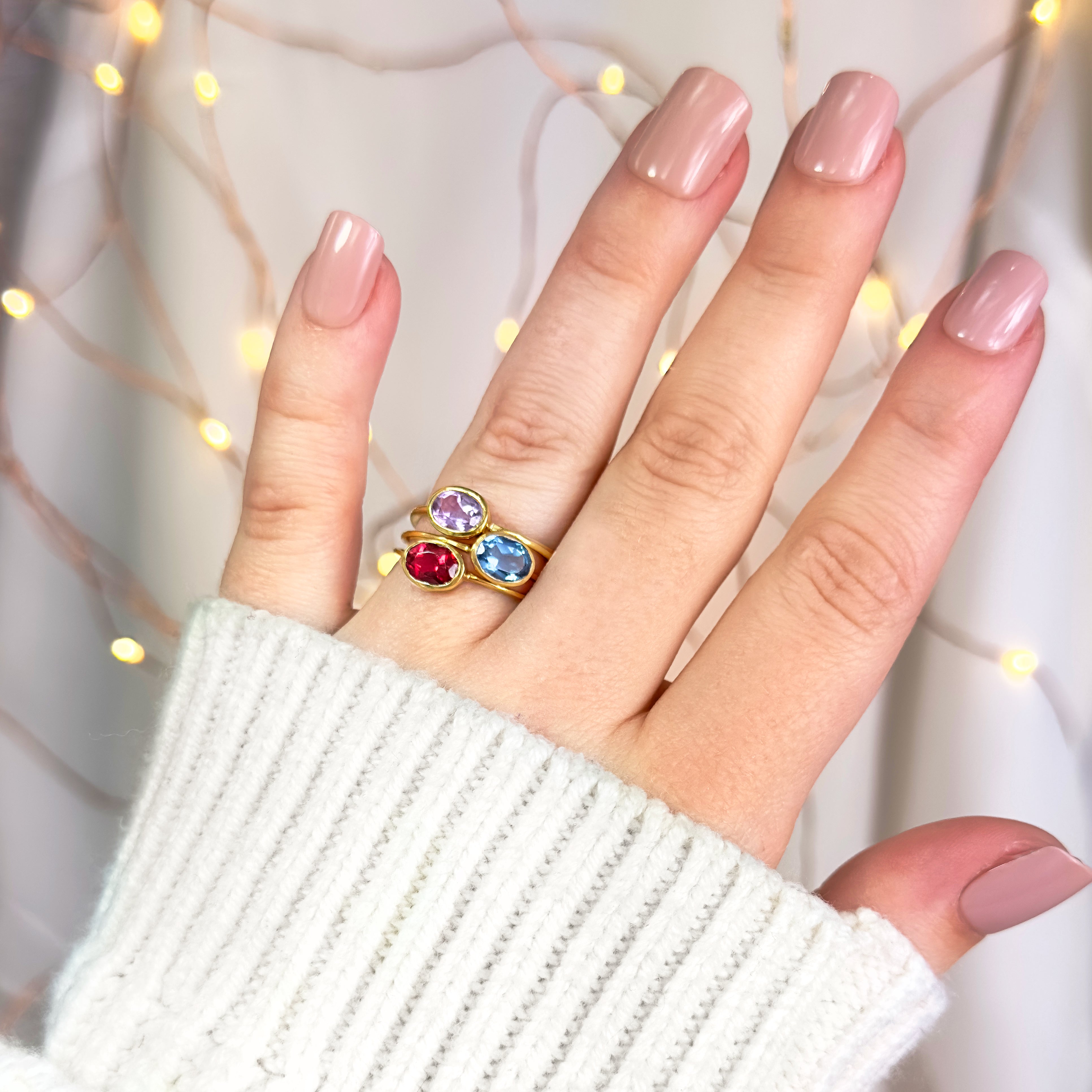 Model stacking garnet, blue topaz and purple amethyst gold plated rings. stack set, stacking rings, gemstone ring, birthstone ring, mother's day gift for her, gift for mom, gift for fiance, gift for girlfriend, wedding jewelry, bridesmaid jewelry, anniversary jewelry, anniversary gift, birthday gift, christmas gift, valentine's day gift, valentine's day rings, dainty ring, cocktail ring, statement ring, bezel set