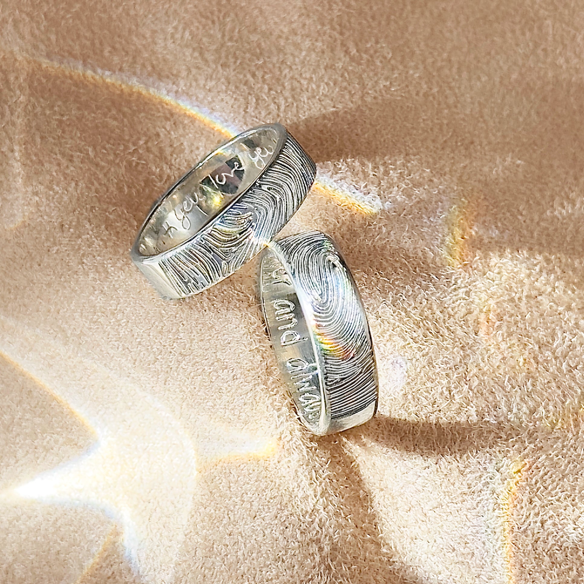 two sterling silver 6mm bands with fingerprint on the outside and handwriting on the inside. Gift for her, gift for him, memorial gift, commemorative gift, gift for fiance, gift for husband, gift for wife, gift for girlfriend, gift for boyfriend, silver anniversary gift, wedding gift, graduation gift, gift giving ready, christmas gift, valentine's day gift, birthday gift, family reunion gift, funeral gift, gift for those who lost loved ones, unique gifts for men, unique gifts for women. sterling silver band