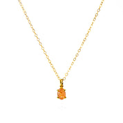 Oval natural Sunstone Cabochon Bezel Set into a 925 Sterling Silver Pendant Plated in 18k Vermeil Gold sitting on a 14K Gold Filled Cable Chain resting on a white background. Great as a gift for fall lovers and orange color and sunstone lovers.