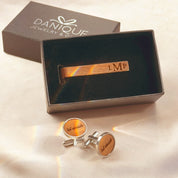 Rustic wooden cufflink and tie bar set with personalized engraving, presented in a Danique Jewelry gift box. The custom tie clip features engraved initials while the round cufflinks display “’til death” design, creating a unique and stylish men’s accessory set. Perfect for rustic weddings, groomsmen proposals, anniversary gifts, or personalized business attire. A thoughtful gift for husband, boyfriend, or dad to wear on formal occasions and keep as a lasting keepsake.