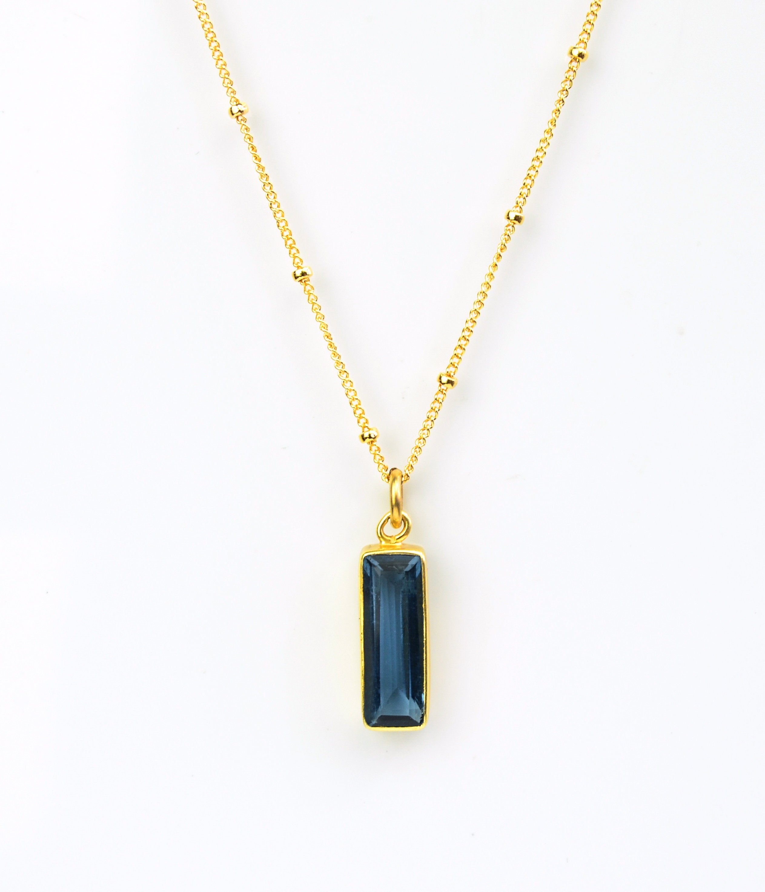 Single gold filled satellite chain with vertical september kyanite adira bar birthstone.