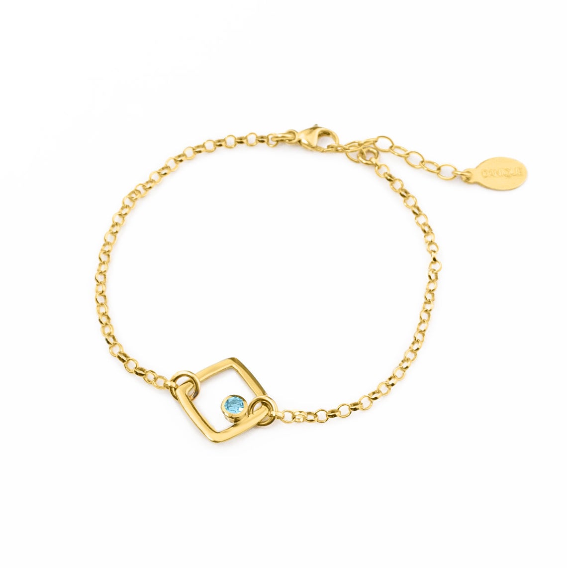 Single gold filled square geometric shape bracelet with blue topaz birthstone on a white background.