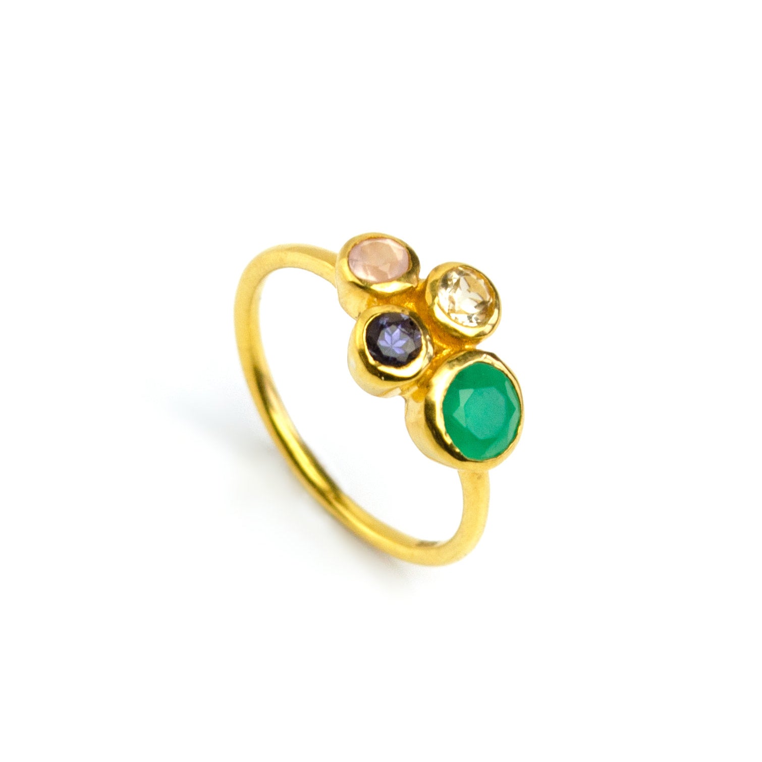 Single gold plated custom mother of three birthstone ring. Mom stone is green onyx, kid's stones are pink chalcedony, kyanite and citrine on white background