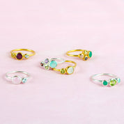 Shop the entire 5mm and 3mm birthstone rings available in gold, silver or rose gold. This features a mother's 5mm stone with 3mm kids stones.