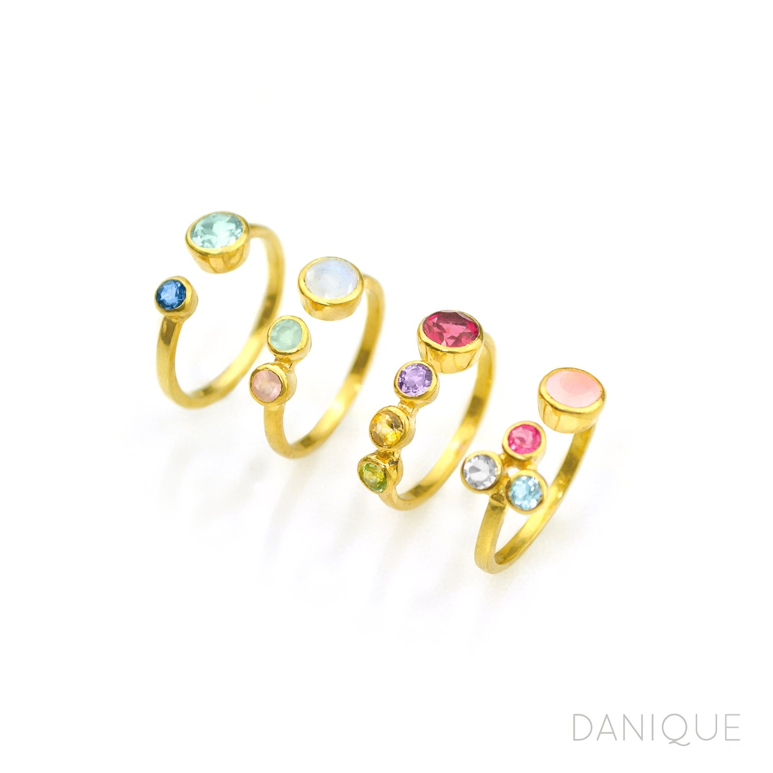 Mother's Adjustable Ring Collection Up to Three Small Stones Gift for Mom gold filled four rings shown featuring blue topaz, kyanite, moonstone and pink and aqua chalcedony, ruby with peridot, citrine and purple amethyst, and pink chalcedony with clear, blue topaz and ruby birthstones