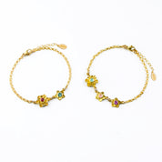 Two gold filled bloom bracelets. Mother of one bracelet on the left with ruby and kyanite birthstones. Mother of two on the right with aqua chalcedony, pink chalcedony and purple amethyst birthstones.