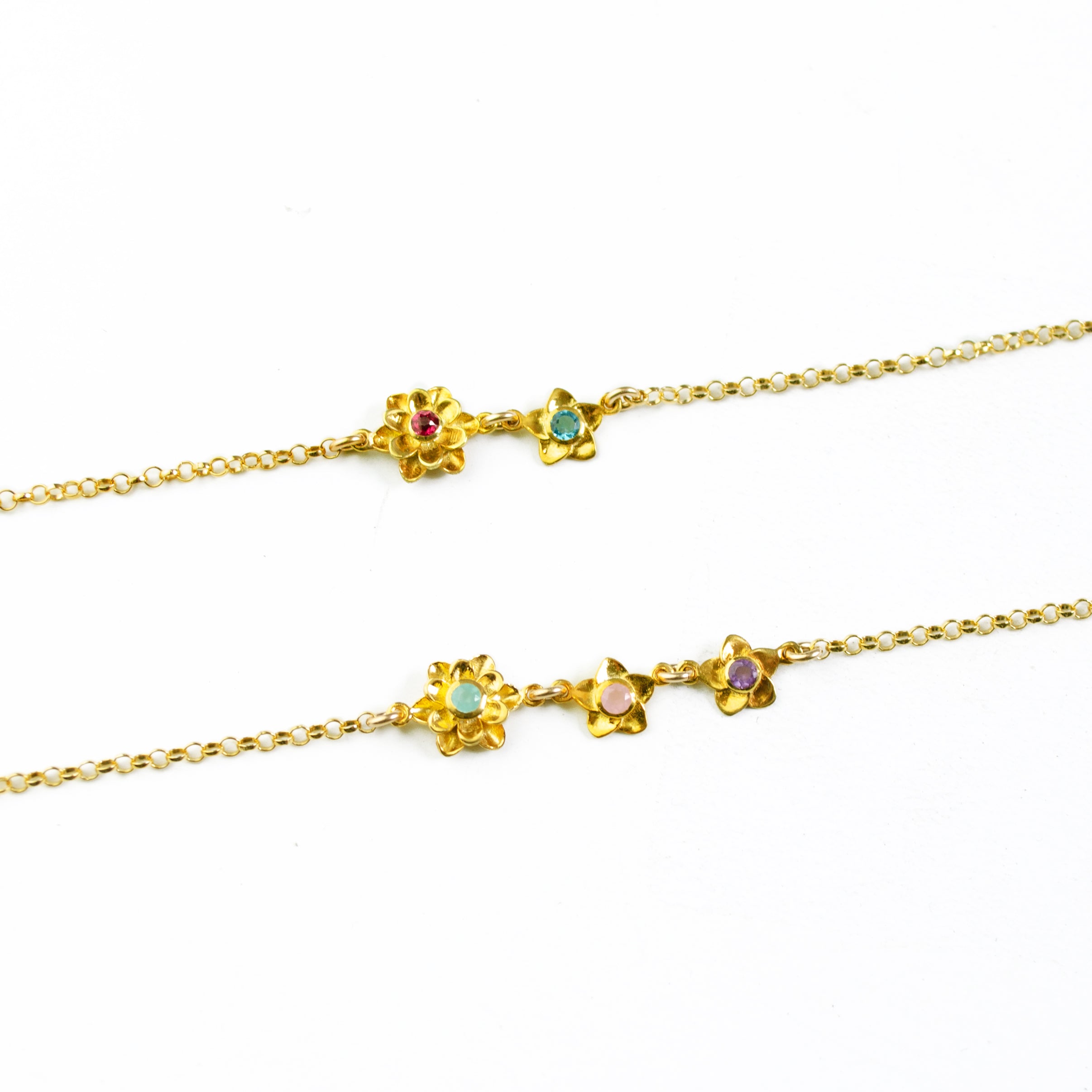 Top gold filled bloom bracelet is a mom of one with ruby and blue topaz birthstones. Bottom gold filled bloom bracelet for mom of two with aqua chalcedony, pink chalcedony and purple amethyst.