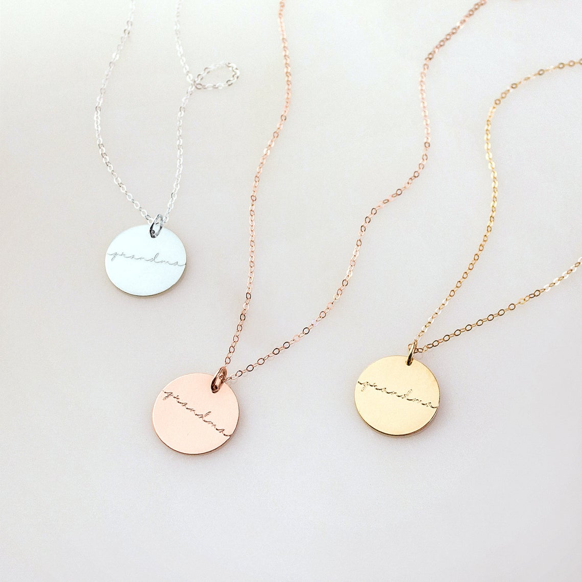 Mama  grandma 19mm disc necklaces come in rose gold filled, sterling silver or gold filled. Necklaces from left to right are sterling silver, rose gold plated, gold plated