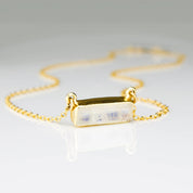 June Birthstone rainbow moonstone horizontal bar necklace with a gold filled chain.
