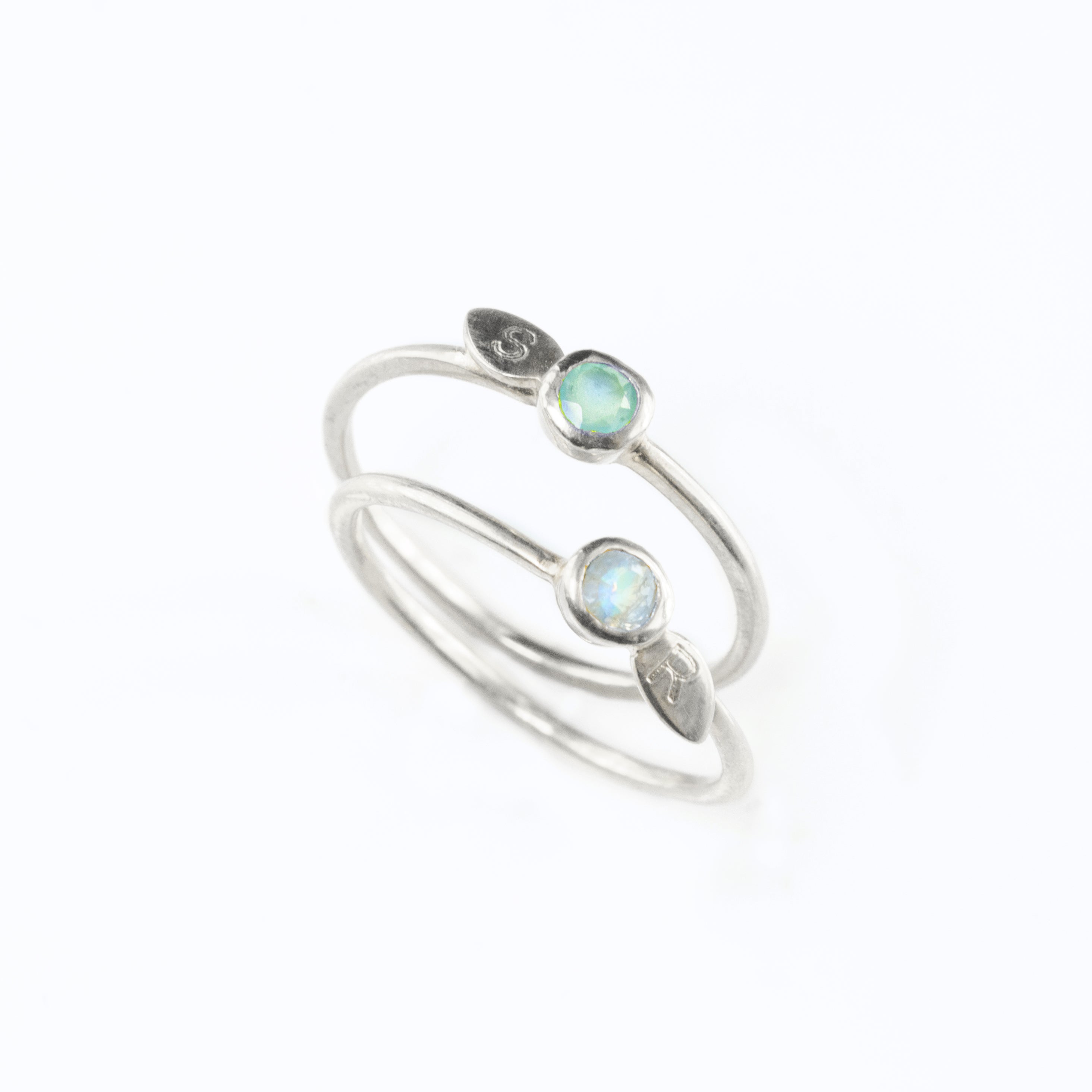 Two sterling silver leaf initial 3mm birthstone ring with aqua chalcedony and moonstones. Each engraved leaf.