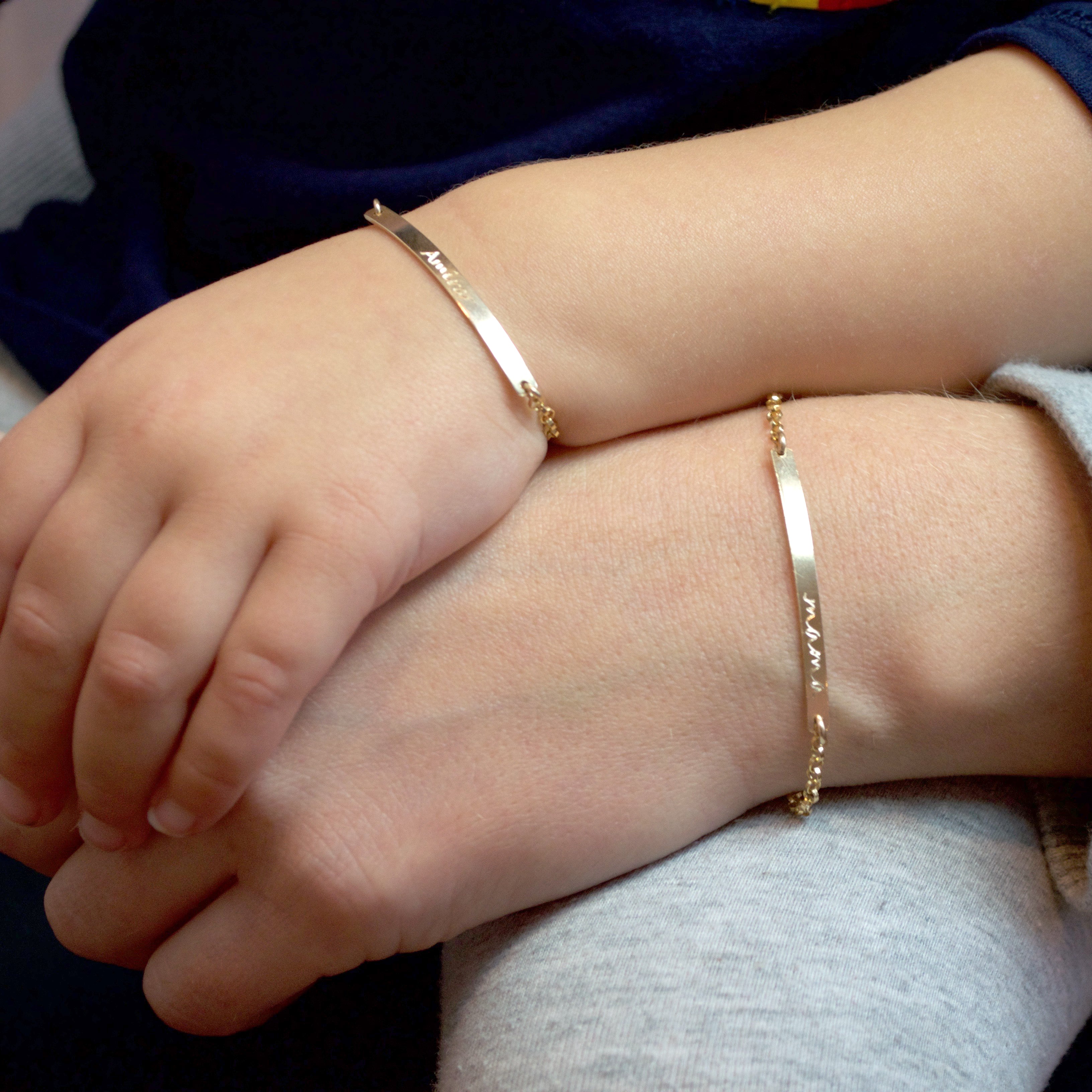 Mother and Child with matching personalized gold filled skinny bar bracelets engraved with "mama" and a name. Mother and Child matching jewelry, Mom and daughter matching bracelets, dainty engraved bar bracelets for mom and daughter