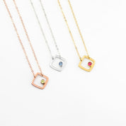 three open square geometric shape necklace in rose gold plating with peridot birthstone, august birthstone. Sterling silver necklace with iolite birthstone, september birthstone or gold plated square with ruby birthstone july birthstone.