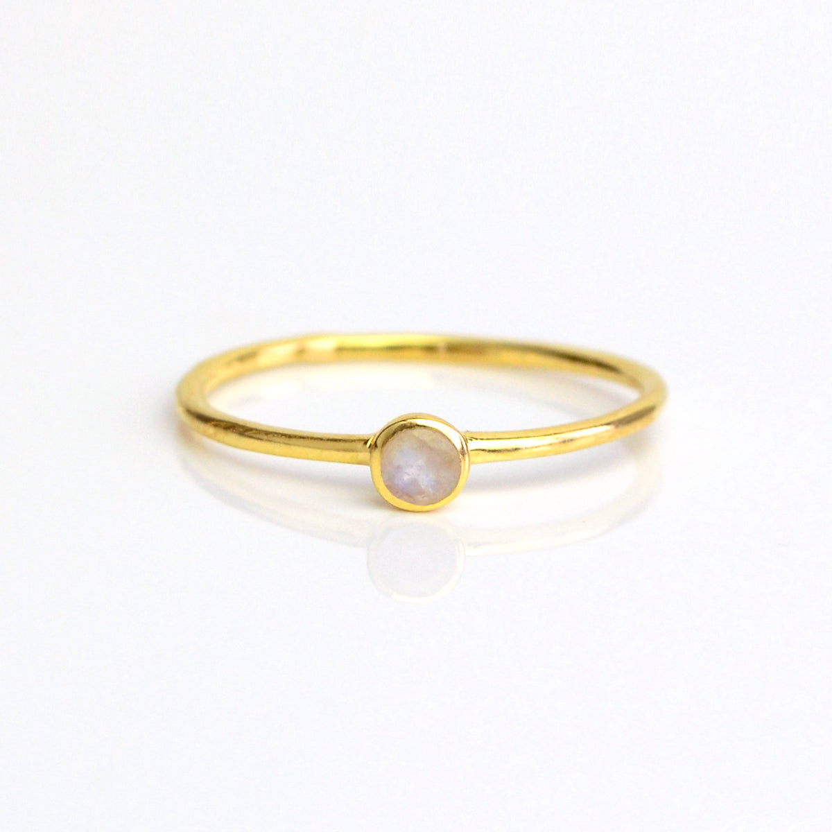 Single gold plated dainty 3mm Moonstone gemstone ring. June  birthstone. On white background. 925 sterling silver, birthstone ring, stacking ring, stackable, birthstone jewelry, facet gemstone