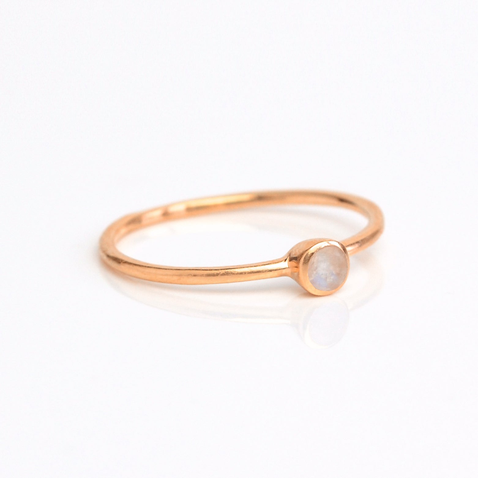 Single rose gold plated dainty 3mm Moonstone gemstone ring. June  birthstone. On white background. 925 sterling silver, birthstone ring, stacking ring, stackable, birthstone jewelry, facet gemstone