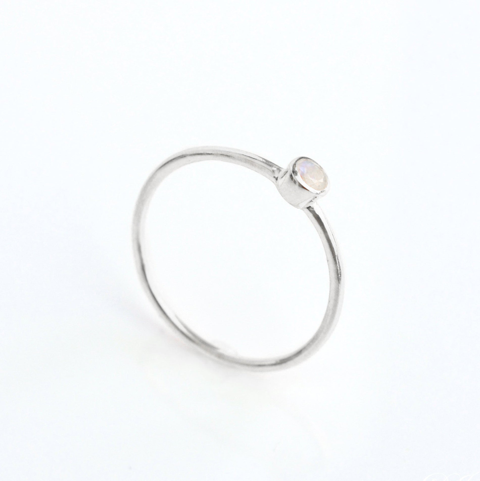 Single sterling silver dainty 3mm Moonstone gemstone ring. June  birthstone. On white background. 925 sterling silver, birthstone ring, stacking ring, stackable, birthstone jewelry, facet gemstone