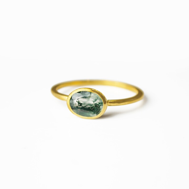 a gold moss agate ring shown on white background. stackable! Stacking rings, bezel set, small oval, tiny oval, dainty oval, birthstone rings, sterling silver stamp, birthstone ring, birthstone jewelry