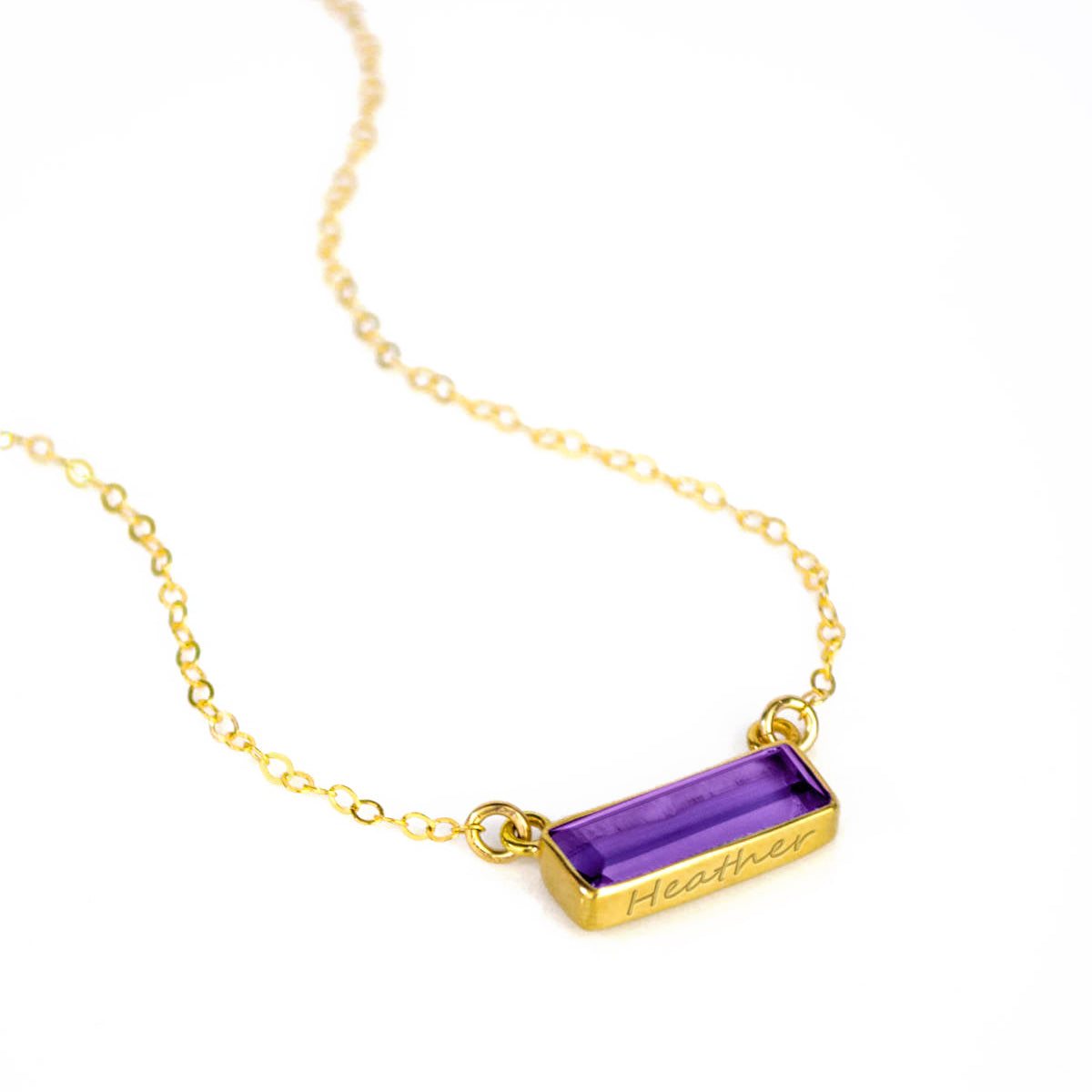 Horizontal gold filled February birthstone purple amethyst adira bar necklace with name engraved in script font.