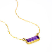 Horizontal gold filled February birthstone purple amethyst adira bar necklace with name engraved in script font.