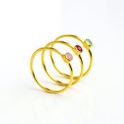 three gold plated dainty 3mm gemstone rings featuring aqua chalcedony, garnet and pink chalcedony. On white background. 925 sterling silver, birthstone ring, stacking ring, stackable, birthstone jewelry, facet gemstone