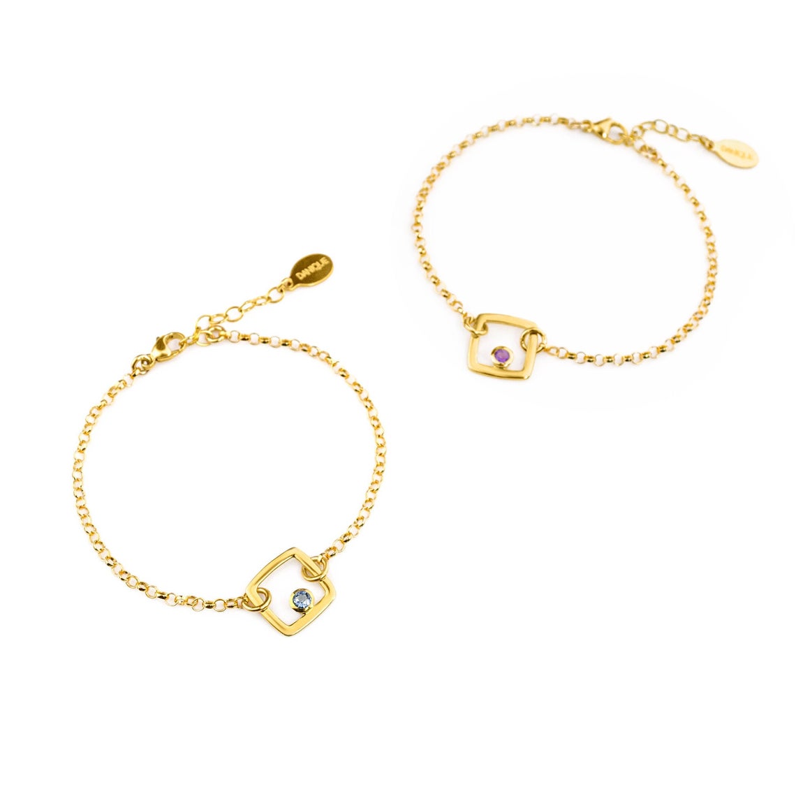 Two gold filled geometric square adjustable bracelets with kyanite and purple amethyst birthstones on a white background.