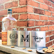 Three custom engraved stainless steel flasks in with different designs: name and message monogram, best man wreath design and best papa ever design. Fantastic personalized gift for party, wedding, christmas, birthday.