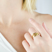 Model in white top is wearing a collection of three stacking rings gold plated name bar rings with purple amethyst, ruby, and peridot birthstones. engraved name ring, birthstone jewelry, birthstone ring