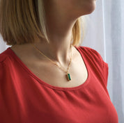 Model in red top is wearing the vertical adira necklace with a gold filled satellite chain.