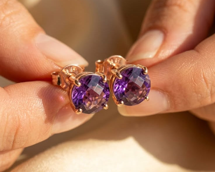 Amethyst stud earrings in rose gold held in hand, elegant gemstone studs for women, perfect gift for Mother’s Day, birthday jewelry, bridesmaid earrings, wedding accessories, minimalist fine jewelry