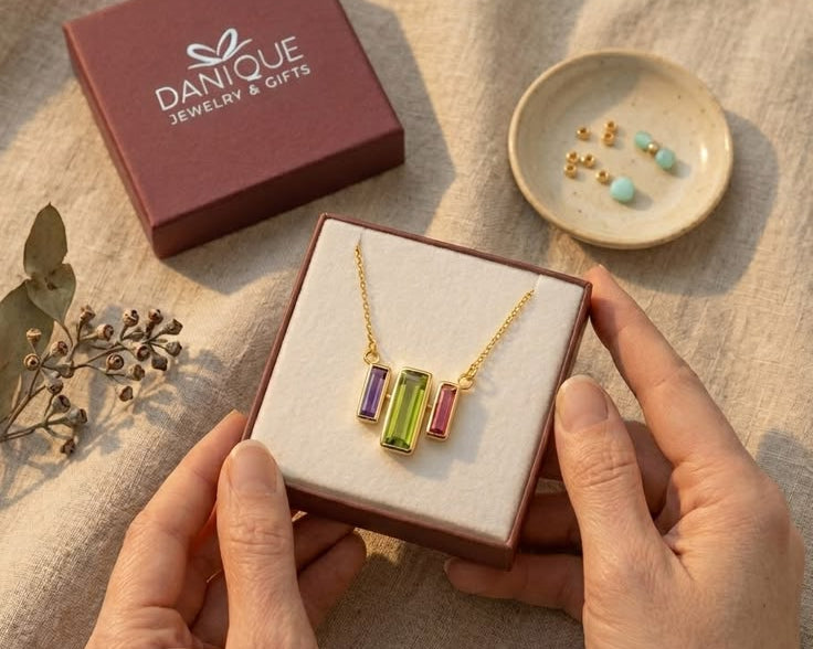 Custom birthstone bar necklace with colorful baguette stones in a Danique gift box, a meaningful personalized jewelry gift for mom, grandma, birthdays, or Mother’s Day in gold, silver, or rose gold.