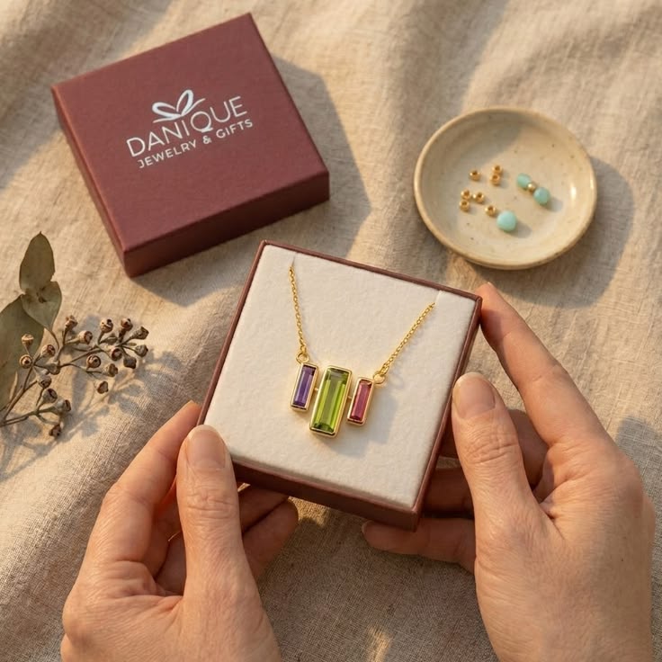Custom birthstone bar necklace with colorful baguette stones in a Danique gift box, a meaningful personalized jewelry gift for mom, grandma, birthdays, or Mother’s Day in gold, silver, or rose gold.