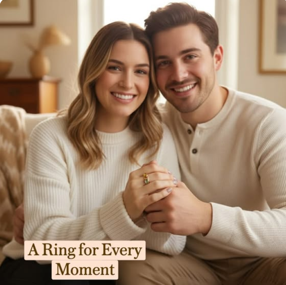 Smiling couple sitting together at home, woman wearing stackable oval birthstone rings with colorful gemstones, personalized stacking rings symbolizing family, love, and meaningful life moments.