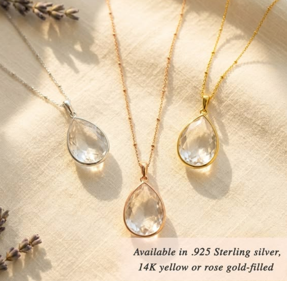 Clear quartz teardrop necklaces in gold and silver on neutral background, April birthstone jewelry, minimalist crystal pendant, elegant gift for Mother’s Day, birthday, bridal jewelry, wedding necklace