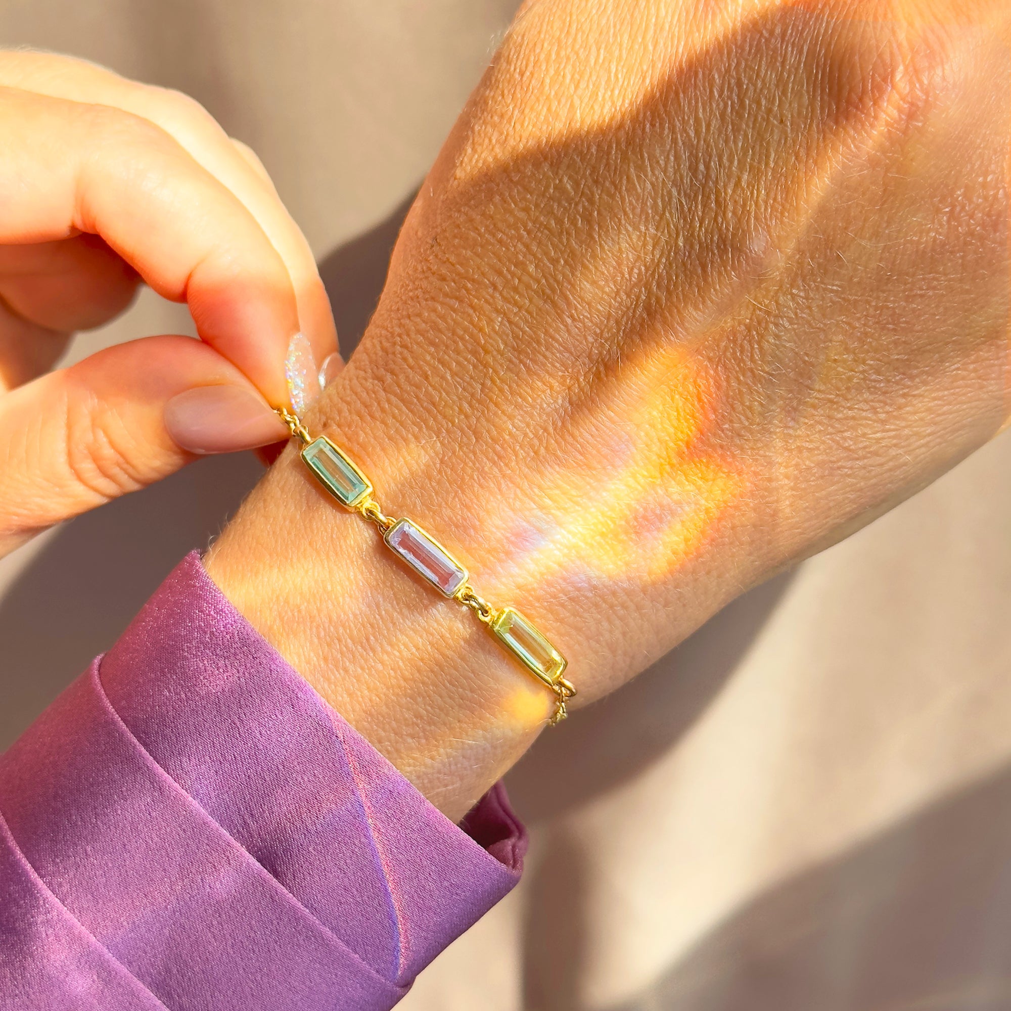 Custom baguette birthstone bracelet in gold with rectangular gemstones on wrist, personalized family birthstone bracelet for mom, minimalist gold birthstone jewelry, custom birthstone bracelet gift for women