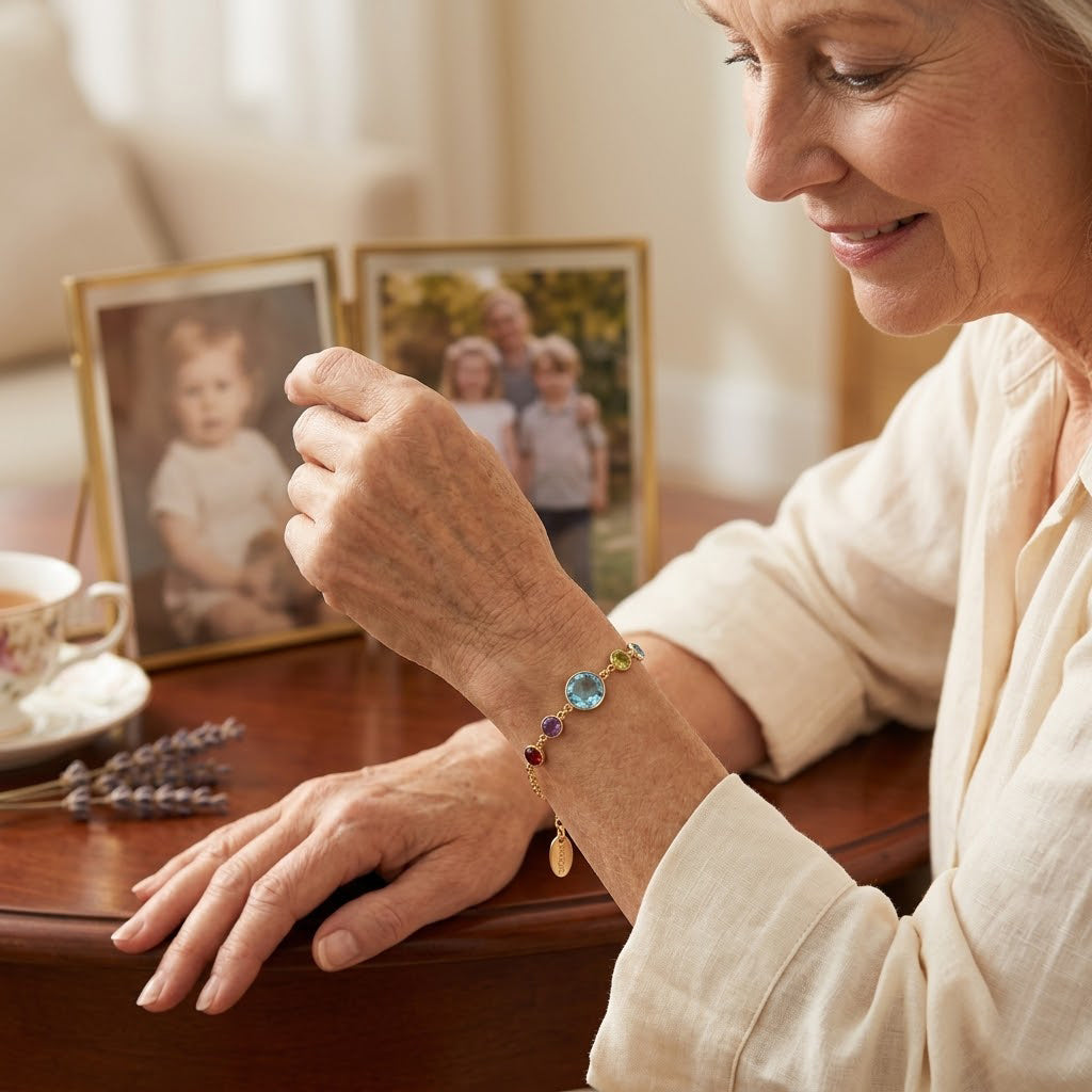 grandma wearing a custom birthstone bracelet while looking at family photos, a thoughtful keepsake jewelry gift with personal meaning.