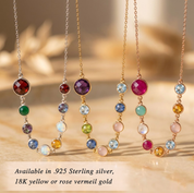 Necklaces with colorful gemstones on a wooden surface