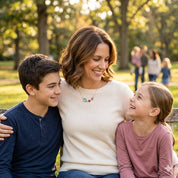 Mother wearing personalized birthstone necklace with children, meaningful family jewelry gift for mom or grandma with kids’ birthstones