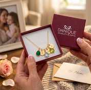 Danique Jewelry gift box with personalized birthstone and initial necklace, ready for gifting to mom or grandma.