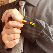2. Lifestyle
Man wearing personalized gold bar cufflinks with a dress shirt and formal suit.
