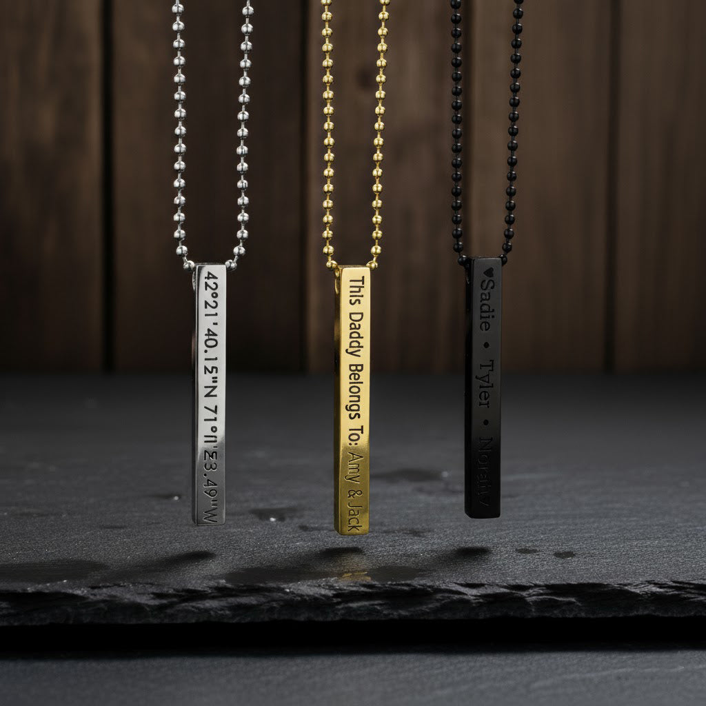Three 3d Bar necklaces in silver with coordinates in block font, gold with a custom phrase in modern thin font, or black with names engraved in typewriter font.